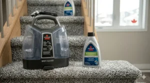 Close-up of a portable carpet cleaner for stairs featuring bilingual English and French instructions for the Canadian market.
