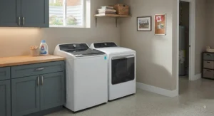 A matching high-efficiency top load washer and dryer set arranged in a finished basement laundry area.