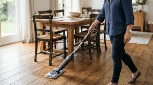 Quick cleanups around the dining table using a microfibre spray mop for hardwood floors